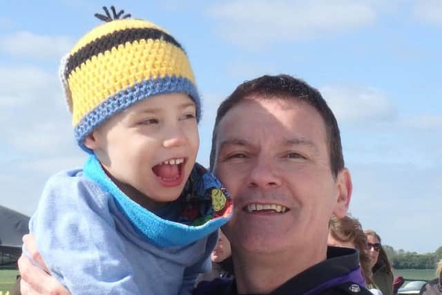 Charlie Bonnick with his father, Steve. Charlie's family are trying to raise Â£10,000 for a multi-sensory room at his home