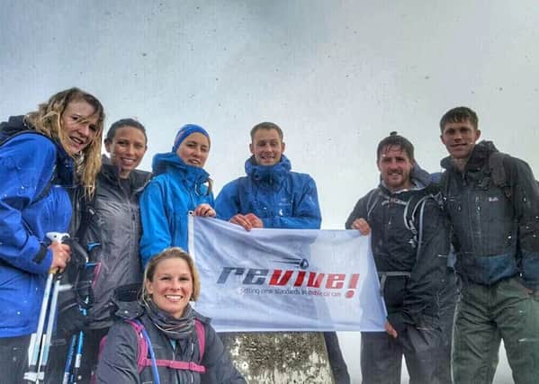 Tom Vanner and  friends at the top of Ben Nevis in Scotland