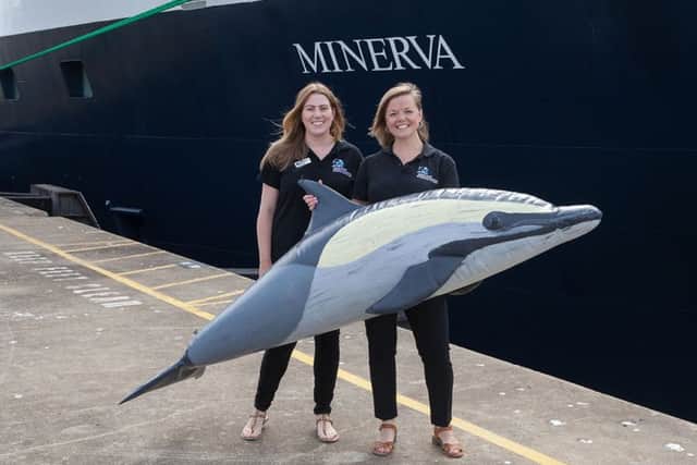 Orca wildlife officers Katrina Gillett, left, and Anna Bunney, in front of Swan Hellenics cruise ship Minerva in Portsmouth