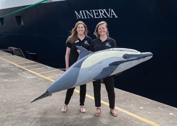 Orca wildlife officers Katrina Gillett, left, and Anna Bunney, in front of Swan Hellenics cruise ship Minerva in Portsmouth