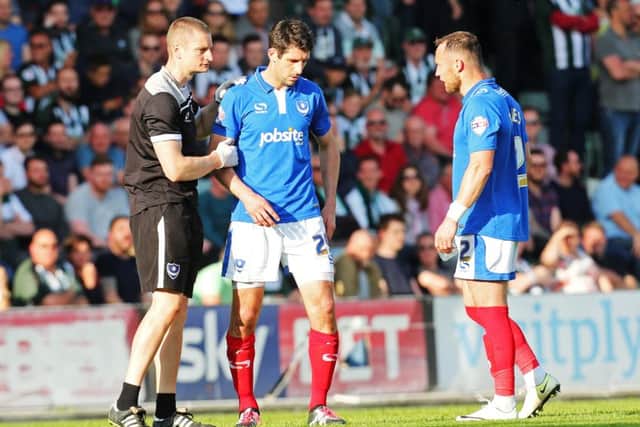 Danny Hollands hobbles out of the play-off semi-final second leg last season. Picture: Joe Pepler