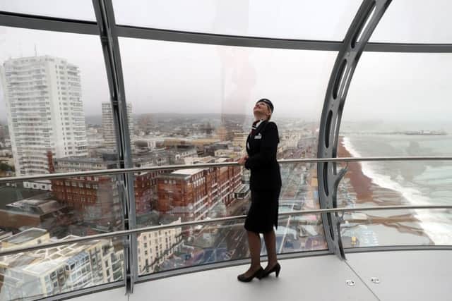 British Airways Global Ambassador Tina Burton looks out of the new British Airways i360 in Brighton, Sussex, as the "vertical pier in the sky" is set to give tourists a new view of Brighton's historic seafront on the site where one of its most famous attractions was built 150 years ago.
Picture: Steve Parsons/PA Wire