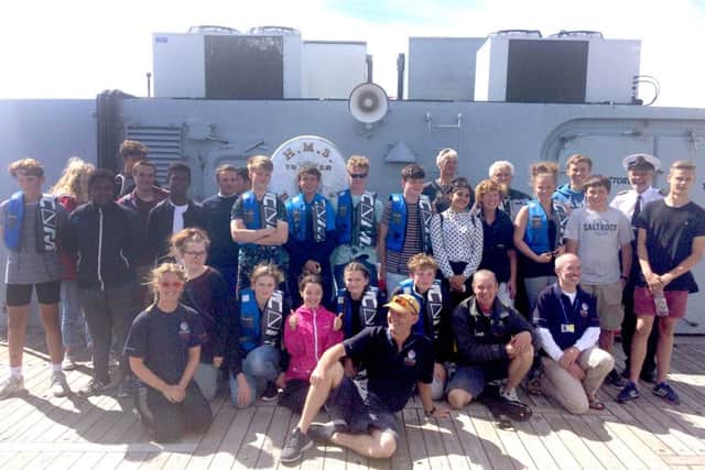 Portsmouth Sail Training Trust competitors and the volunteer team on board HMS Bristol