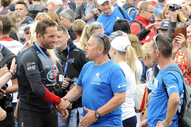 At the America's Cup event on Southsea seafront on Sunday - everyone wants to shake hands or speak to Sir Ben Ainslie as he left the awards ceremony   Picture by: Malcolm Wells (160724-4231)