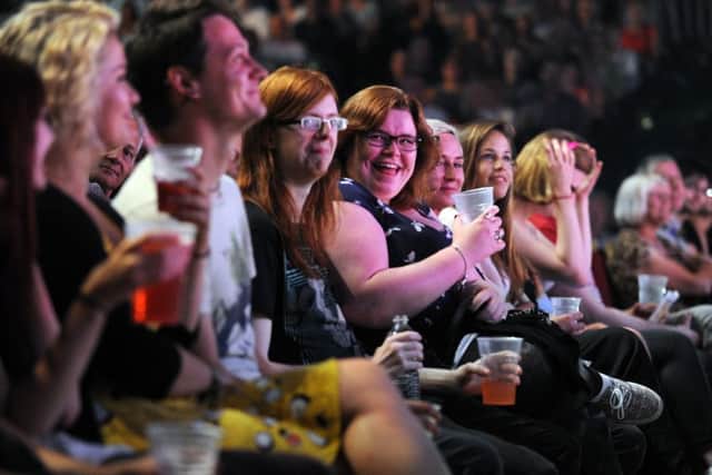 The audience enjoying a comedy show