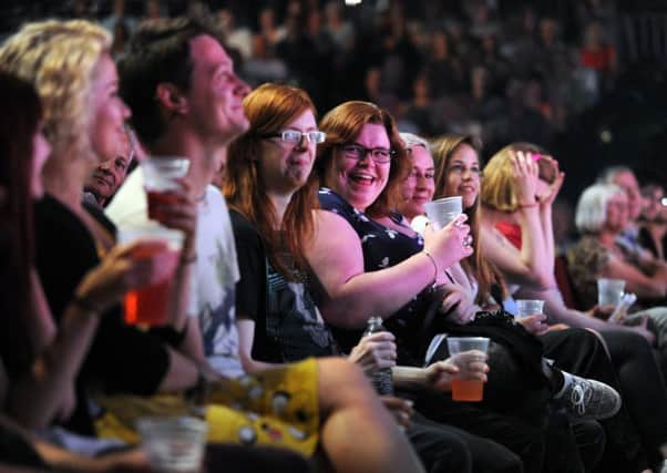 The audience enjoying a comedy show