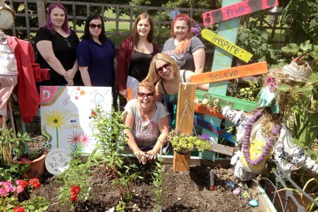 The first Adopt-a-plot group at the Southsea Greenhouse, who have planted a bee friendly garden, and the graduates from the Catch 22 scheme