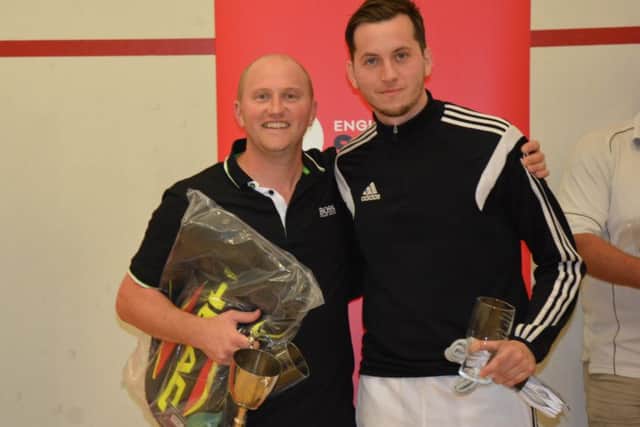 Tim Vail, left, celebrates his eight national racketball title win last month