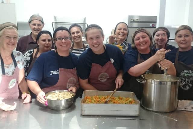 Tesco volunteers at King's Church preparing dinner for the FoodCycle project Picture: Miles O'Leary