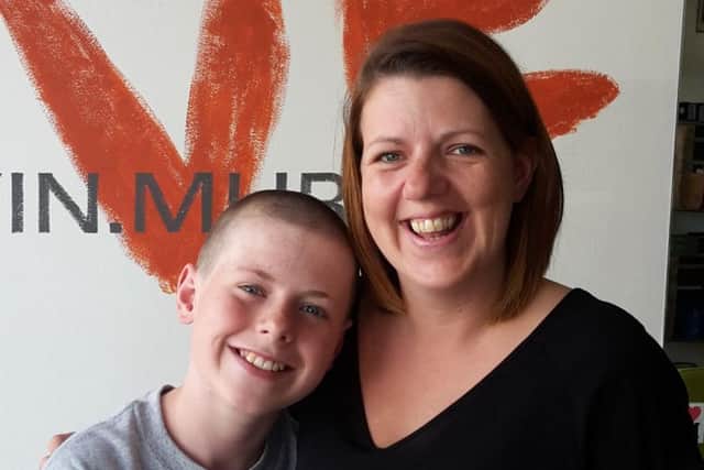 Jake Barker, 12, with his mum Terri Barber after the shave