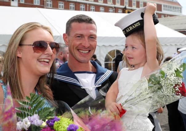 LS(SEA) Daniel Hambling with his wife Amy and their daughter Poppy (3)

.

Image: LPhot Paul Hall
Consent held at FRPU(E)