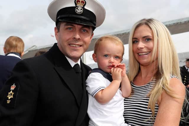 Petty Officer James Gaskell with his daughter Sophia (2) and fiance Jodie Hubble I

Image: LPhot Paul Hall