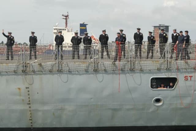The crew of HMS St Albans arrive back in Portsmouth