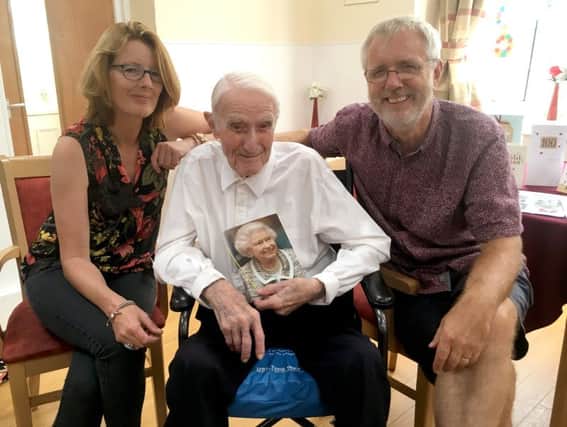Dr Moon celebrates his 100th birthday at Queen Anne Lodge, Southsea, with his daughter Carolyn and son Graham.