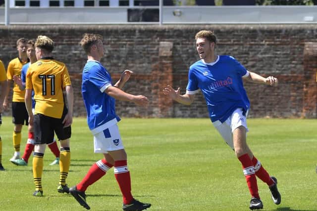 Harvey Bradbury celebrates his and Pompey Academy's second goal in today's 2-2 draw with Newport County Picture: Neil Marshall