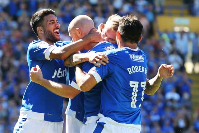 Pompey celebrate Carl Baker's goal. Picture: Joe Pepler