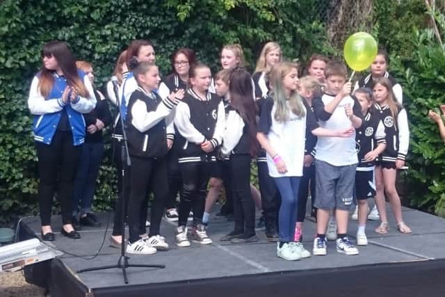 Member of The Young Creatives Portsmouth release balloons in memory of member Imogen Meads, who died of meningitis aged 11