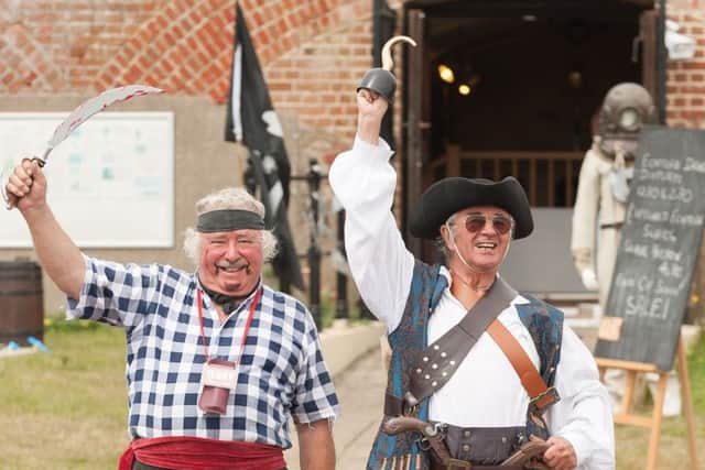 Terry Nash, left, and John Bevan aka 'Cut Throat Jake' give a wave (160003-034)