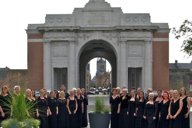 Portsmouth Military Wives Choir performing in front of the Menin Gate