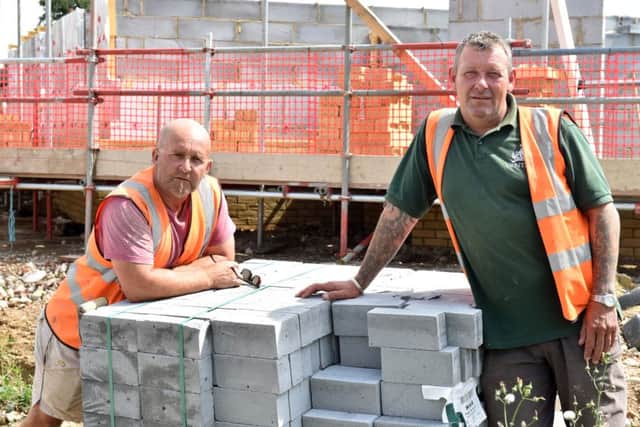 Builders Peter Taylor and Tony Childs at the site