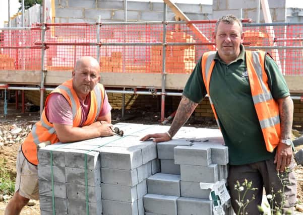 Builders Peter Taylor and Tony Childs at the site