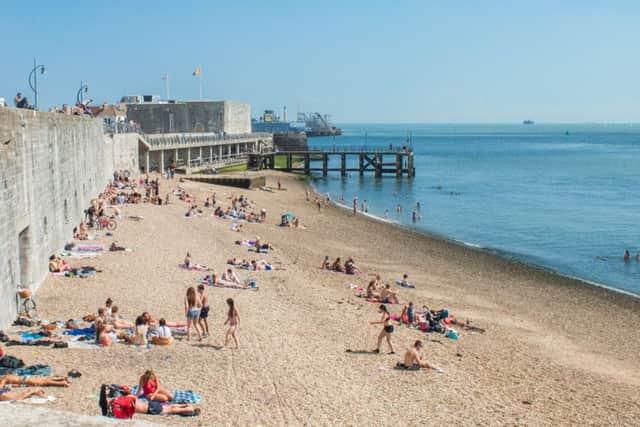 Sun bathers on the beach at the Hot Walls, Old Portsmouth
Picture: Melanie Leininger