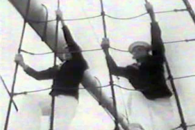 John Noakes, right, during his 1967 Blue Peter film climbing the mast at HMS Ganges