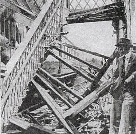 Here can be seen the damaged flight of steps leading  up to the  footbridge crossing.