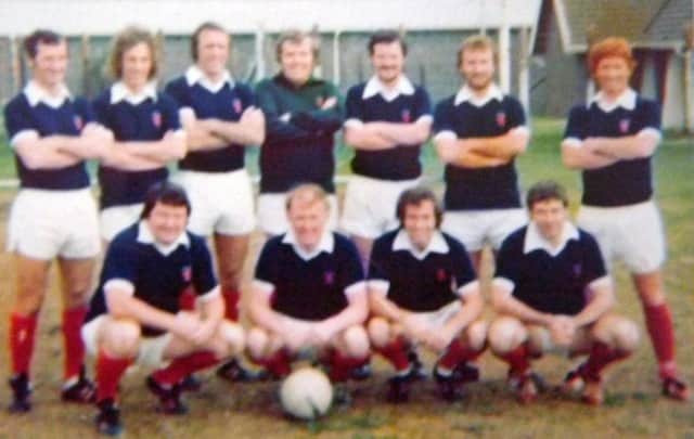 It might be blurred but there's no mistaking England World Cup winner Alan Ball on the right in a Scotland shirt