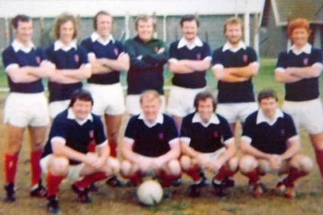 It might be blurred but there's no mistaking England World Cup winner Alan Ball on the right in a Scotland shirt