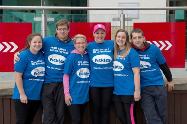 Sam Male (second right) and other volunteers who abseiled down the Spinnaker Tower for Ickle Pickles