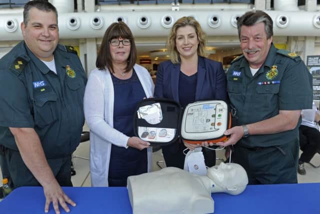From left, paramedic Ian Jones, Anna Morgan who's daughter Sarah died from heart problems, Penny Mordaunt MP and paramedic learning developement officer Dick Tracey Picture Ian Hargreaves (161100-1)