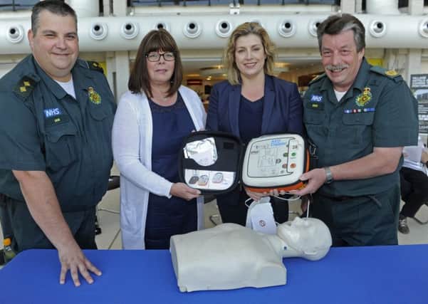From left, paramedic Ian Jones, Anna Morgan who's daughter Sarah died from heart problems, Penny Mordaunt MP and paramedic learning developement officer Dick Tracey 
Picture Ian Hargreaves (161100-1)