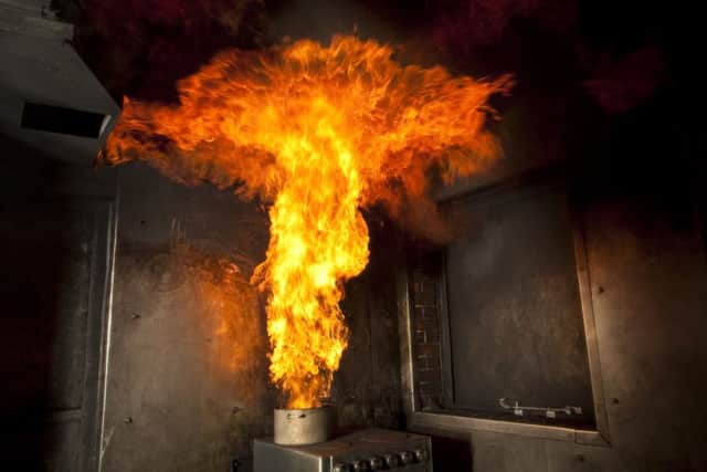 A fire service demonstaration of how a chip pan can catch light