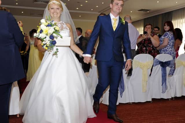 Natalie and John Daniells after tying the knot at their wedding. Picture by: Malcolm Wells (160813-3645)