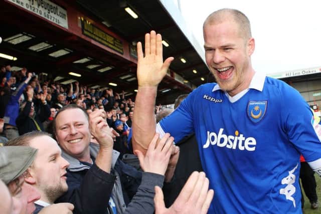 Johnny Ertl celebrates with the Pompey fans after victory at Gresty Road in March 2013 Picture: Joe Pepler