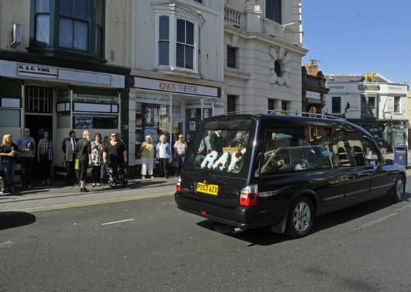 The funeral procession of Albert Road sweet shop owner Ray King stops outside his shop next to The Kings Theatre
Picture Ian Hargreaves (161099-2)