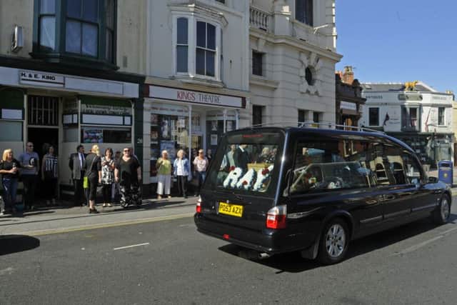 The funeral procession of Albert Road sweet shop owner Ray King stops outside his shop next to The Kings Theatre  
Picture Ian Hargreaves (161099-2)