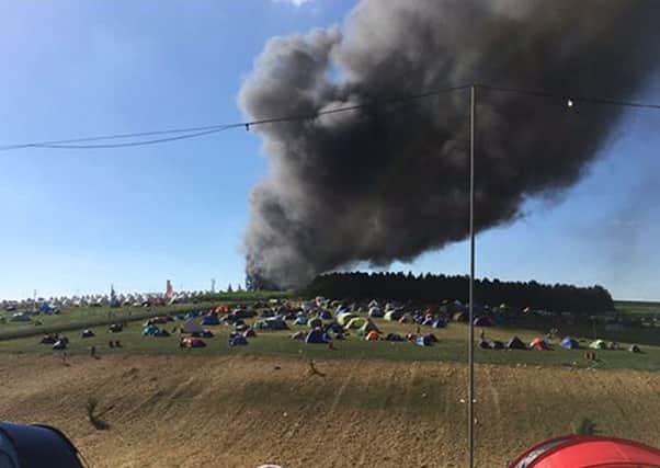 A photo by Adam Coppin of the fire in the car park of the Boomtown Fair Festival