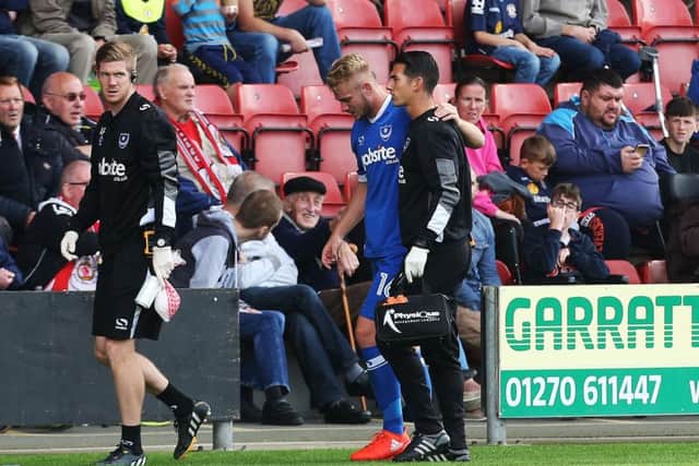 Jack Whatmough limps off at Crewe   Picture: Joe Pepler