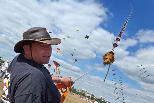 The Brighton Kite Flyers fly a string of 60 kites