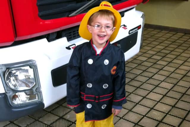 Charlie Codling dressed as a firefighter one week before his diagnosis