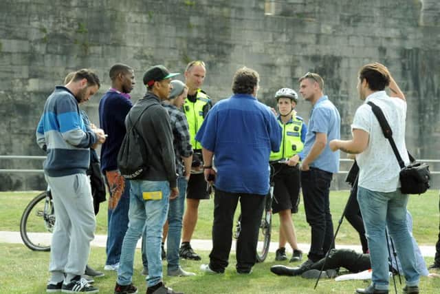 Police and PCSO officers speaking to the public on Castle Field in 2014