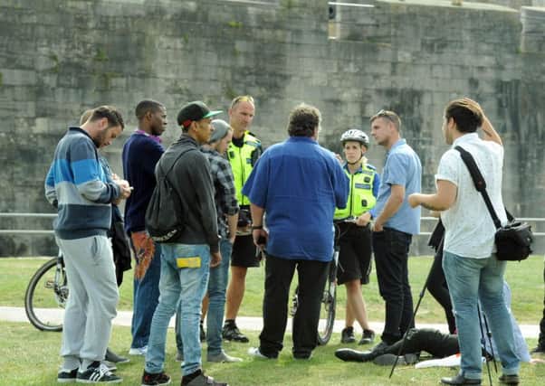 Police and PCSO officers speaking to the public on Castle Field in 2014