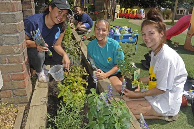 From left, student Bon Curtis with staff member Aisia Howard and student Zoe Watkinson at the Kids centre in Fareham Picture: Ian Hargreaves (161104-1)