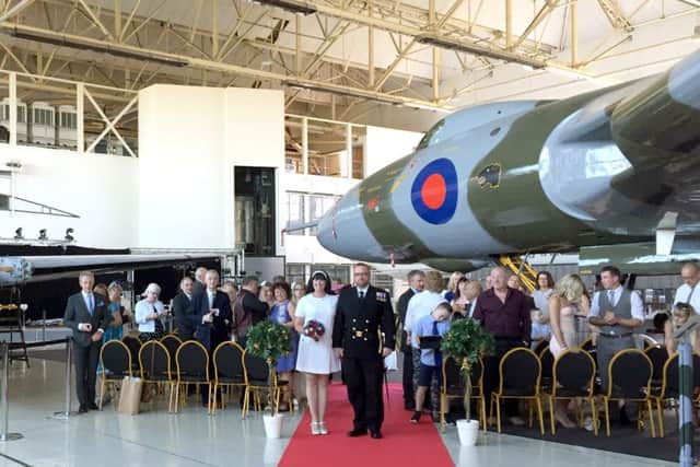 Sarah Coles and Neil Benson under the wings of the Vulcan