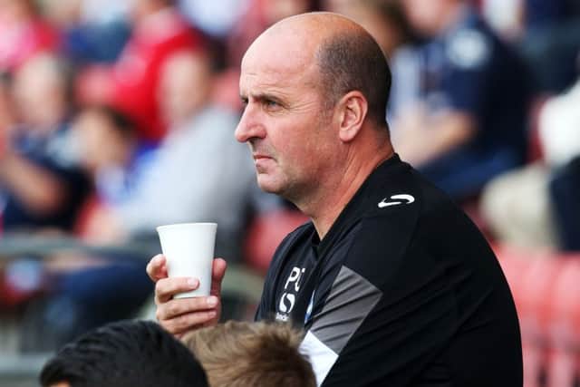Pompey boss Paul Cook takes his side to Morecambe tonight Picture: Joe Pepler
