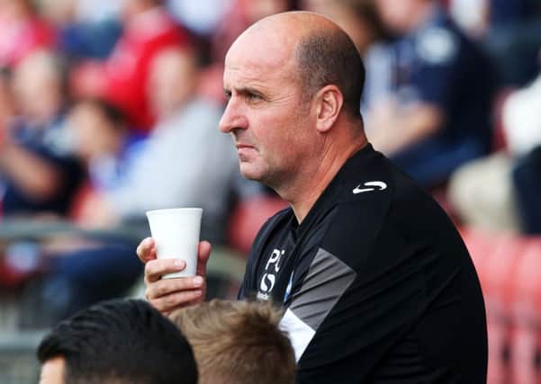Pompey boss Paul Cook takes his side to Morecambe tonight Picture: Joe Pepler