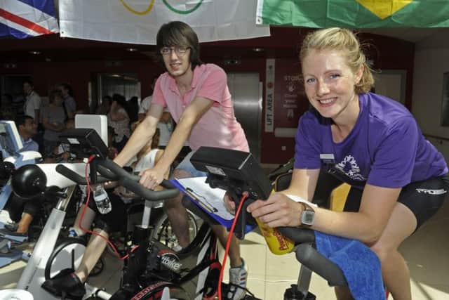 Alex Halladay, left, from Gosport gets pedalling with physiotherapist and charity cycle organiser Harriett Herbert who works in the stroke department at QA
Picture: Ian Hargreaves (161105-1)