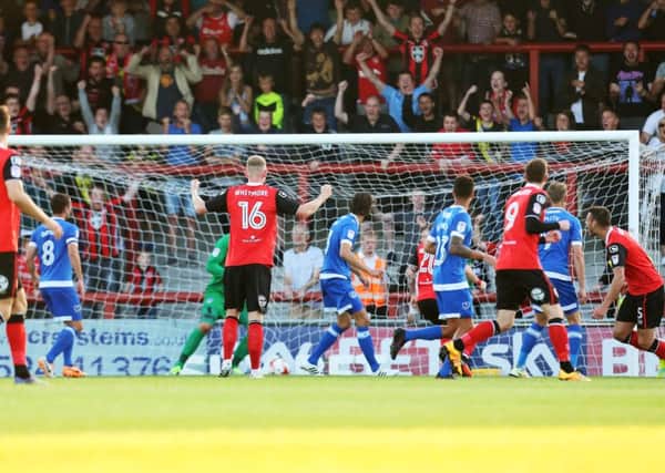 Ryan Edwards hands Morecambe the lead against Pompey at the Globe Arena last night